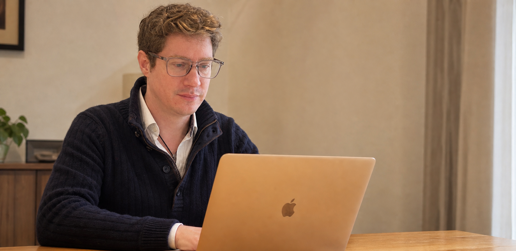 Francois Racette working at his computer in his office